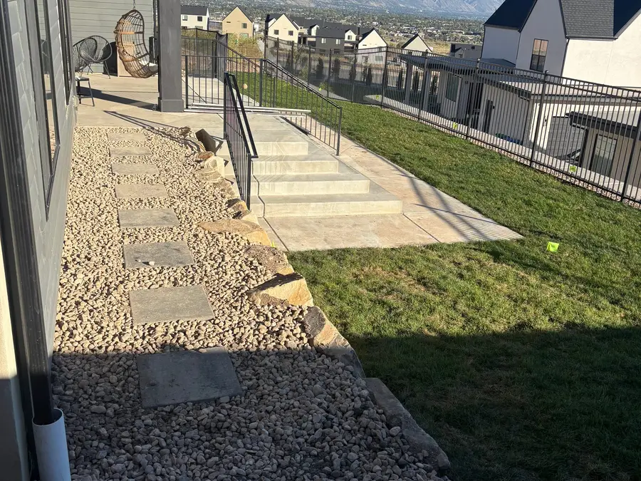 Stone path and steps beside a home with a mountain view